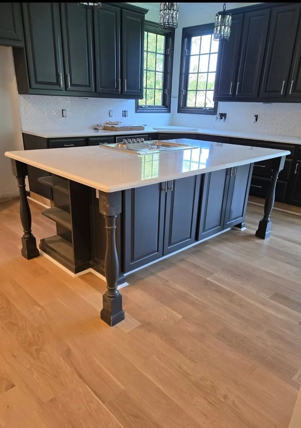 Modern dark navy kitchen cabinets with white quartz island in Northern Kentucky