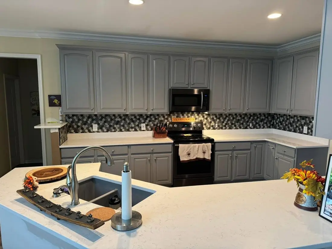 Gray painted kitchen cabinets with hexagonal mosaic backsplash &mdash; F&C Kitchen Solutions Cincinnati